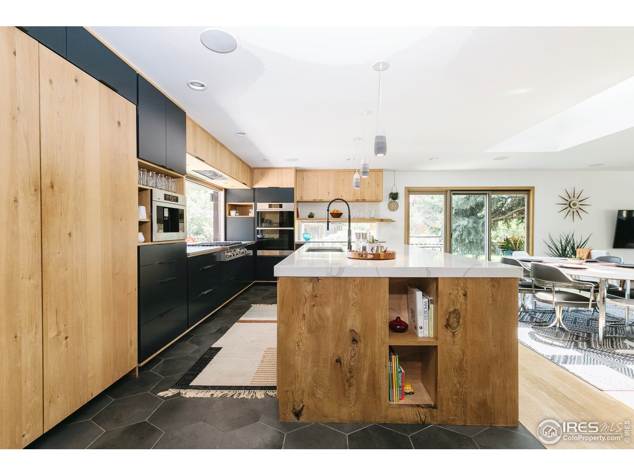 2600 West Prospect Road Fort Collins, CO 80526 - Photo 19 of 40 a living room with stainless steel appliances kitchen island granite countertop furniture and a kitchen view