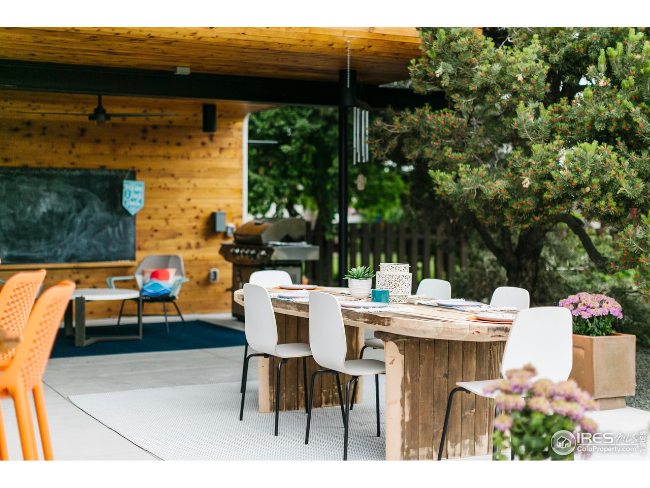 2600 West Prospect Road Fort Collins, CO 80526 - Photo 20 of 40 a view of backyard with table and chairs and potted plants