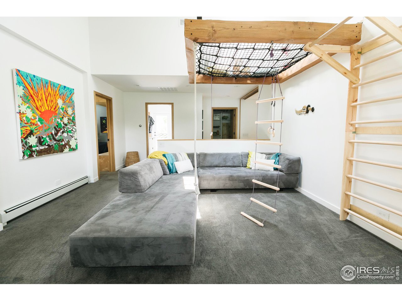 2600 West Prospect Road Fort Collins, CO 80526 - Photo 27 of 40 a living room with furniture a couch and a flat screen tv