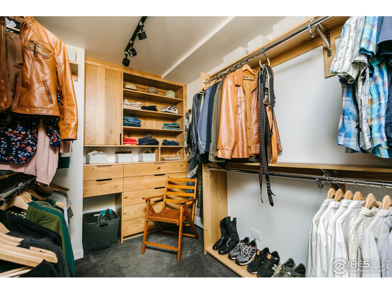 2600 West Prospect Road Fort Collins, CO 80526 - Photo 30 of 40 a view of walk in closet with clothes and shoes