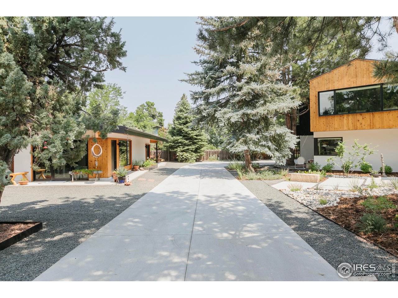2600 West Prospect Road Fort Collins, CO 80526 - Photo 3 of 40 a front view of a house with a yard and garage