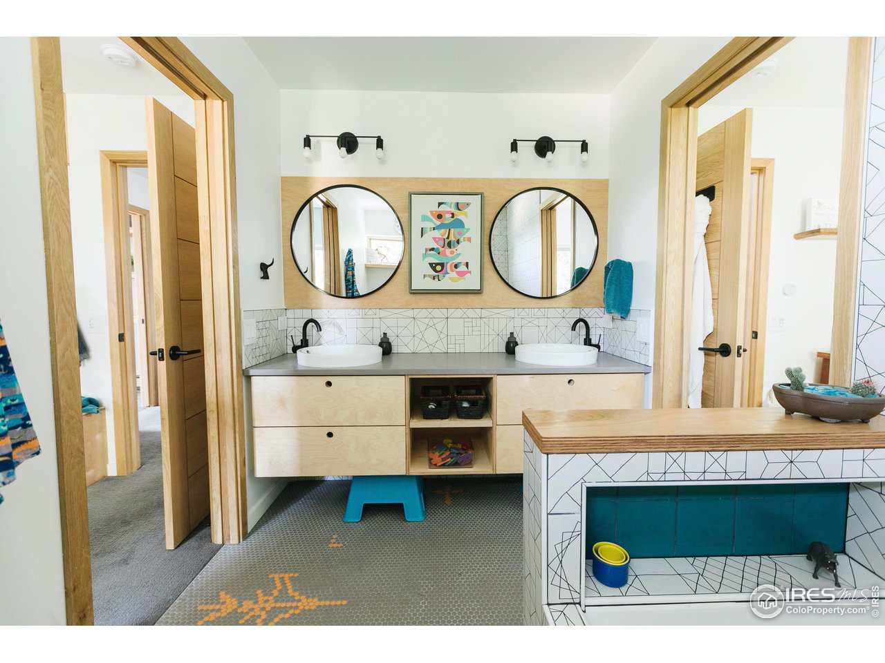 2600 West Prospect Road Fort Collins, CO 80526 - Photo 32 of 40 a bathroom with a sink and a mirror