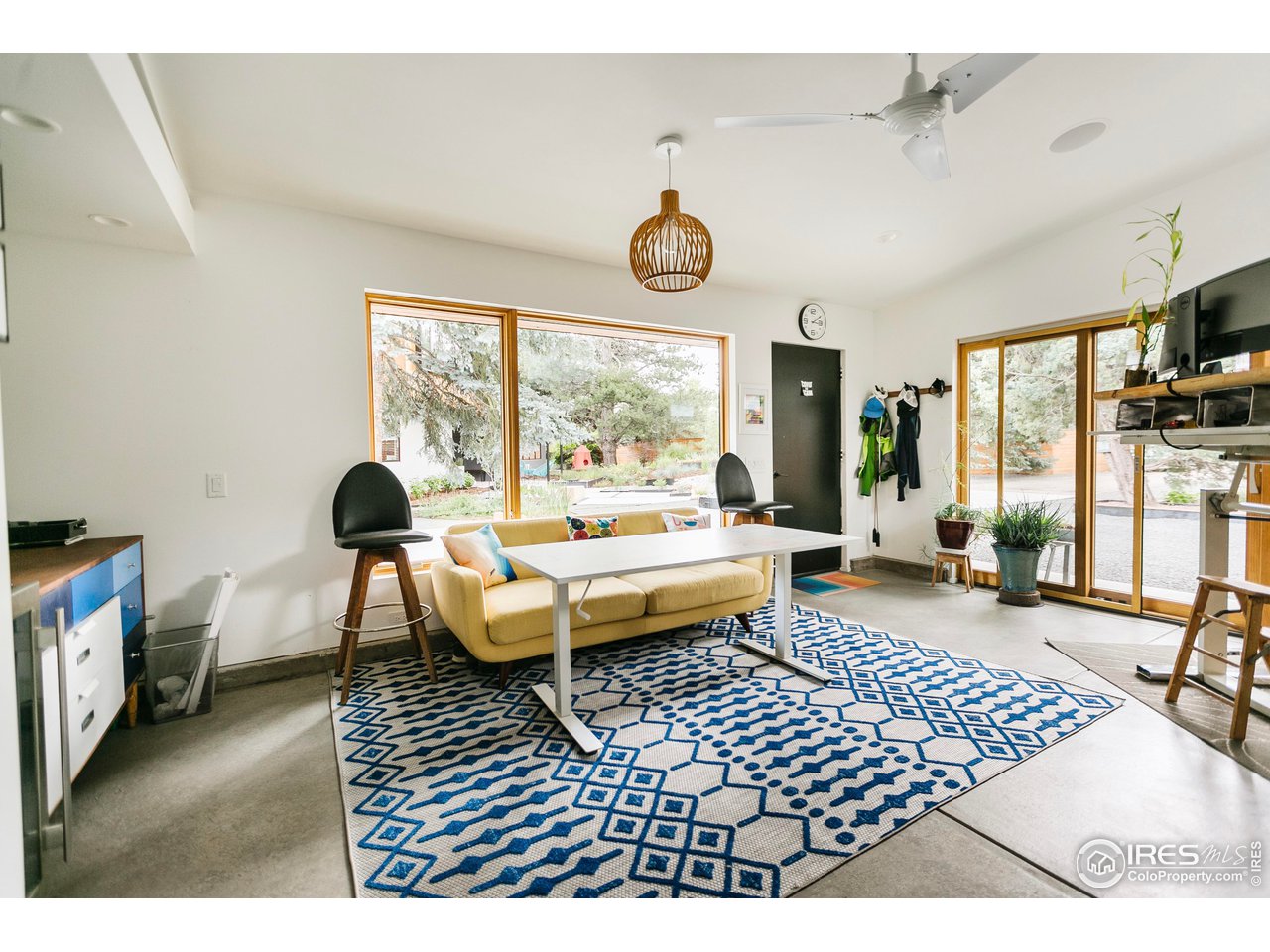 2600 West Prospect Road Fort Collins, CO 80526 - Photo 36 of 40 a living room with furniture wooden floor and a large window