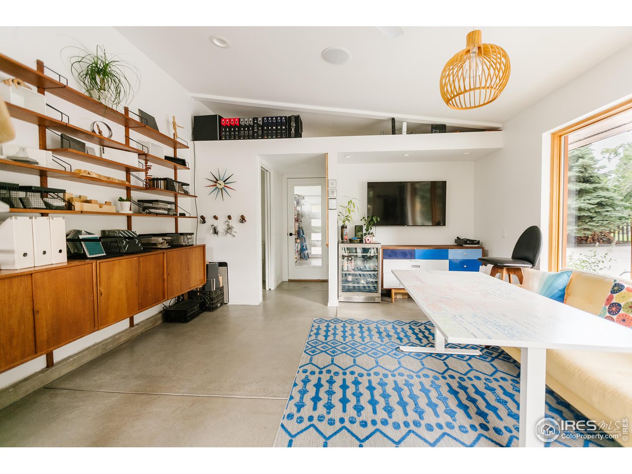 2600 West Prospect Road Fort Collins, CO 80526 - Photo 37 of 40 a bedroom with furniture and a flat screen tv