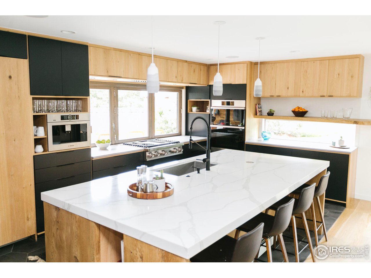 2600 West Prospect Road Fort Collins, CO 80526 - Photo 9 of 40 a kitchen with a table chairs and a refrigerator