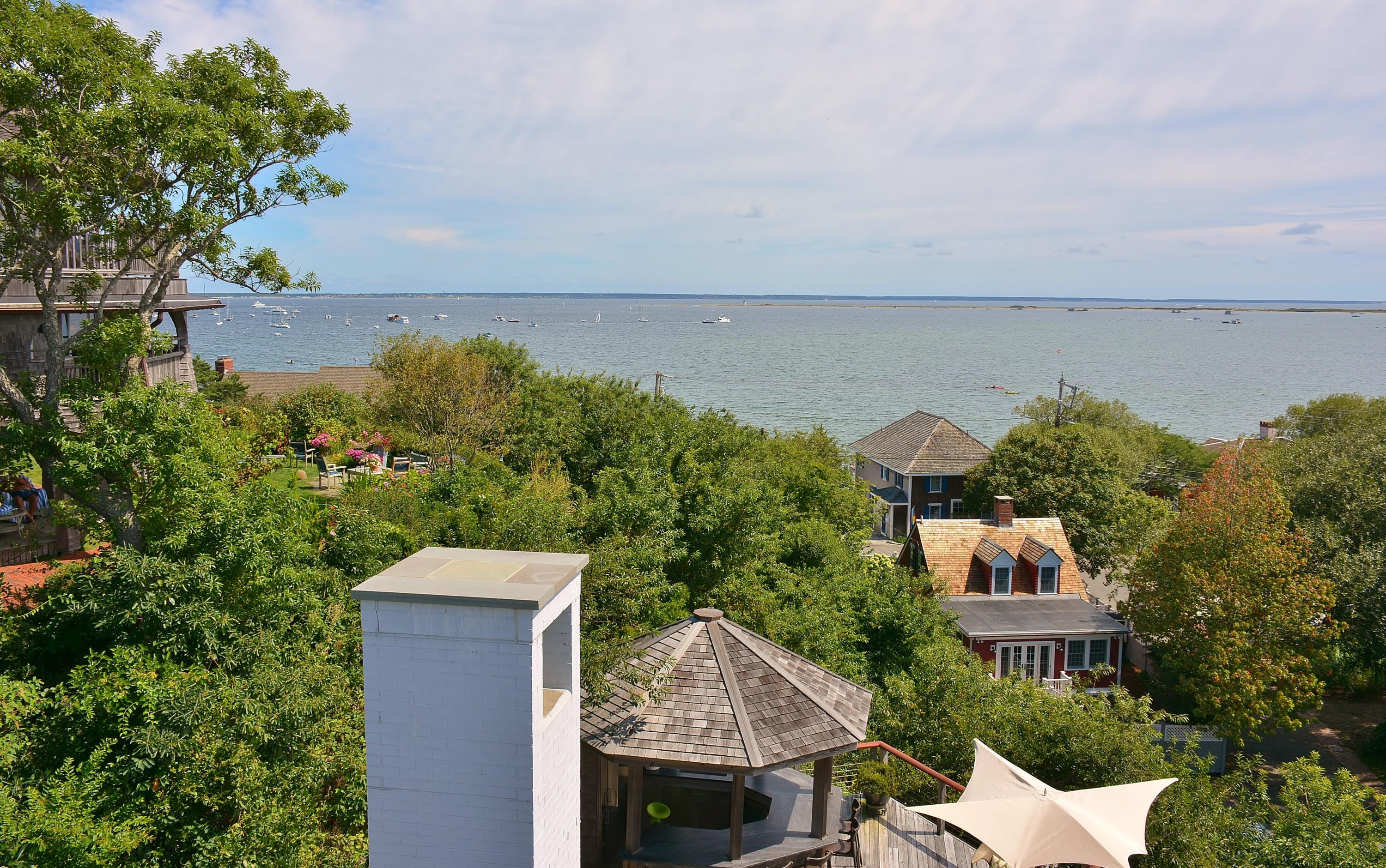 52 R Point Street Provincetown, MA 02657 - Photo 16 of 53 an aerial view of a house with a yard and lake view