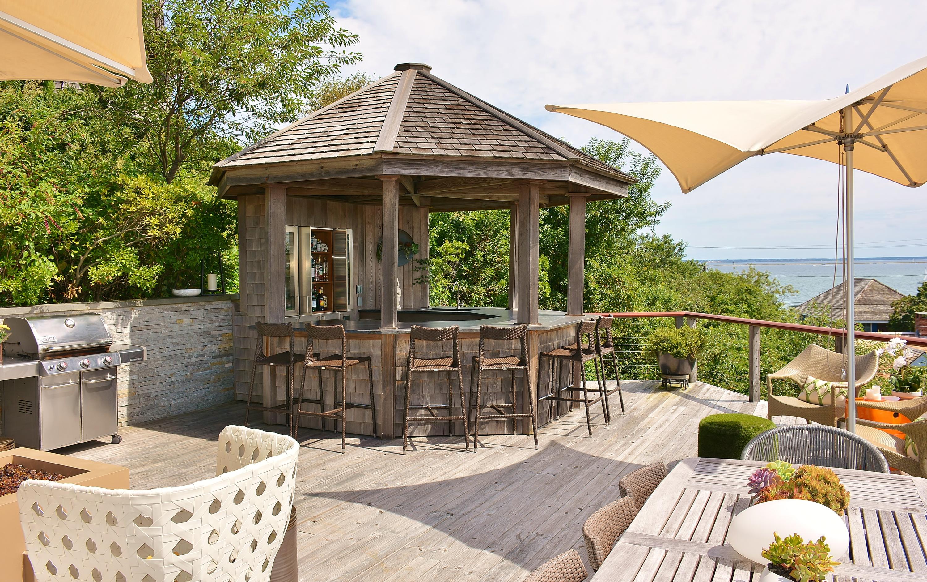 52 R Point Street Provincetown, MA 02657 - Photo 18 of 53 a view of a patio with couches chairs and wooden floor
