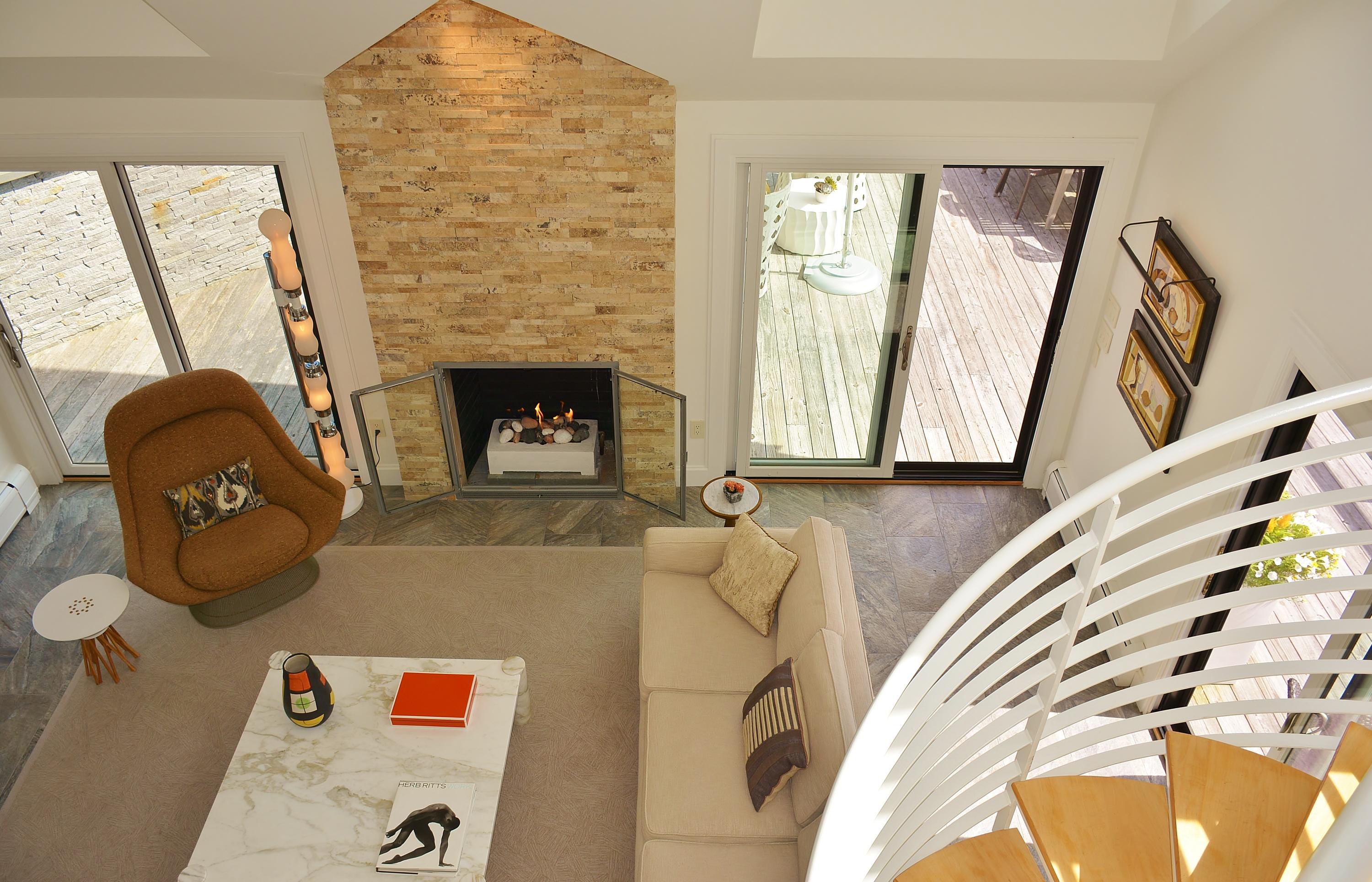 52 R Point Street Provincetown, MA 02657 - Photo 36 of 53 a living room with furniture and a fireplace