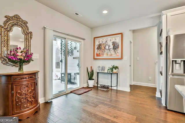 a kitchen with kitchen island a counter top space a sink appliances and cabinets