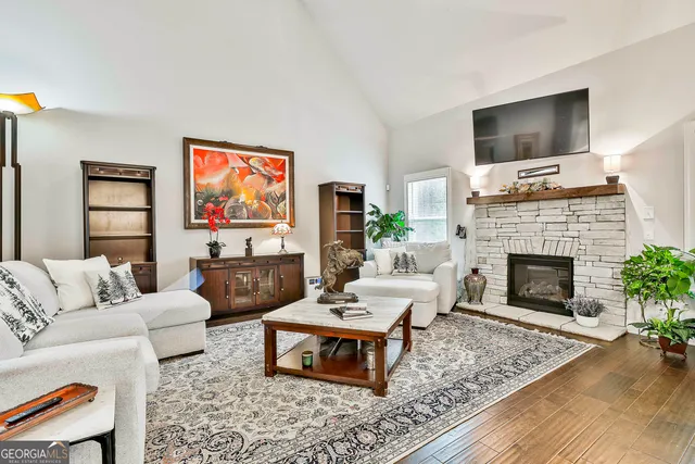a living room with furniture and a fireplace