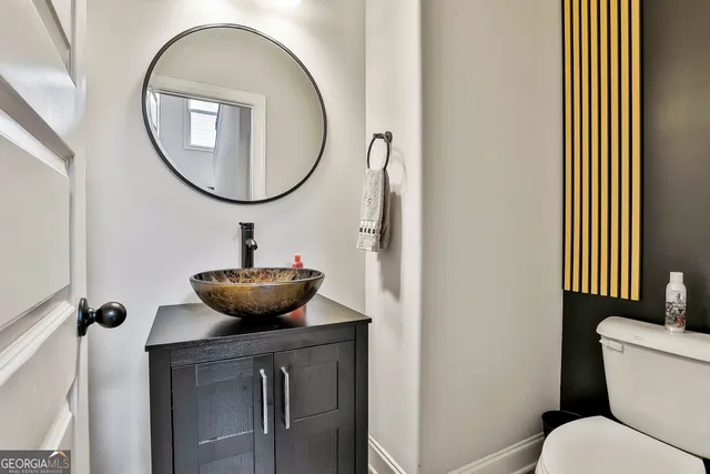 a bathroom with a double vanity sink a mirror and shower