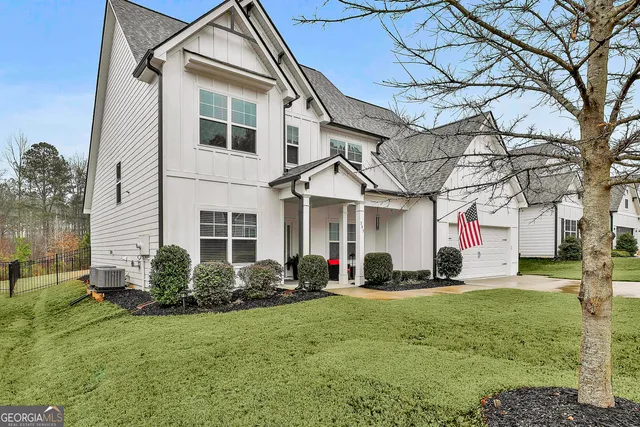 a front view of a house with a yard