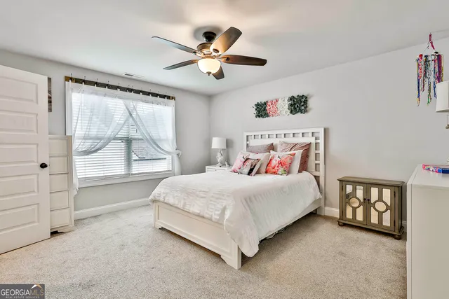 a view of a patio with a table and chairs