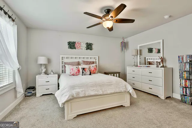 a view of a patio with chairs and potted plants