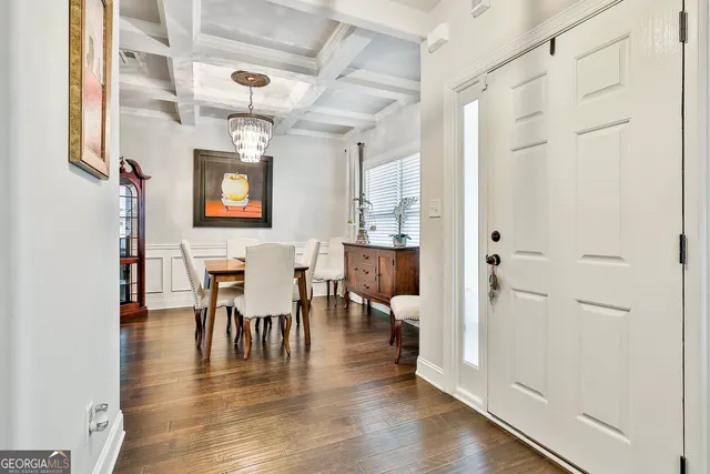 a view of a dining room with furniture window and wooden floor