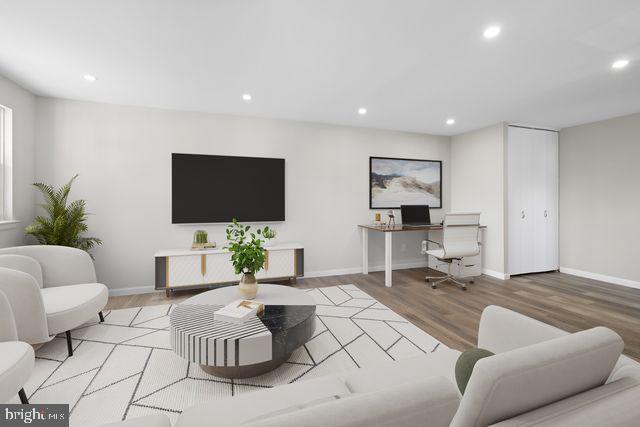 5477 Houghton Place, Unit 2 Philadelphia, PA 19128 - Photo 1 of 17 a living room with furniture and a flat screen tv