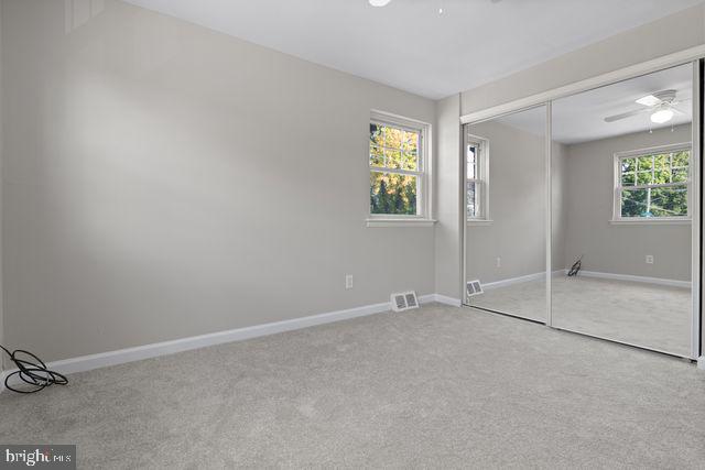 5477 Houghton Place, Unit 2 Philadelphia, PA 19128 - Photo 12 of 17 an empty room with windows and closet
