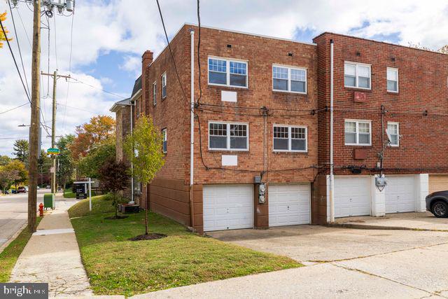 5477 Houghton Place, Unit 2 Philadelphia, PA 19128 - Photo 15 of 17 a front view of a house with a yard