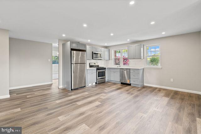 5477 Houghton Place, Unit 2 Philadelphia, PA 19128 - Photo 3 of 17 a view of wooden floor and windows in a room