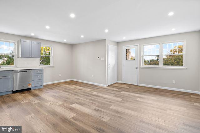 5477 Houghton Place, Unit 2 Philadelphia, PA 19128 - Photo 4 of 17 a view of an empty room with a window and wooden floor