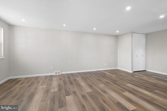5477 Houghton Place, Unit 2 Philadelphia, PA 19128 - Photo 8 of 17 a view of an empty room with wooden floor and a window