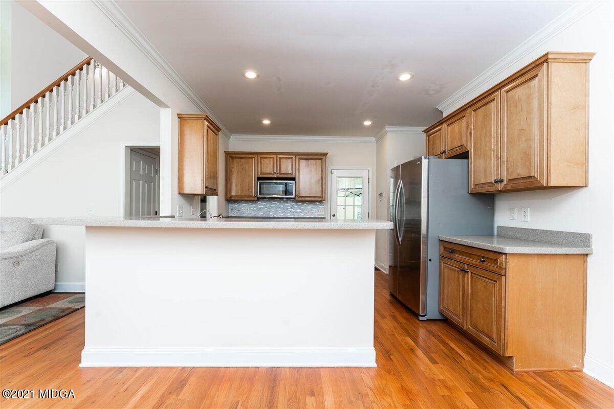 224 Carsons Walk Macon, GA 31206 - Photo 13 of 41 a kitchen with stainless steel appliances granite countertop a refrigerator sink and cabinets