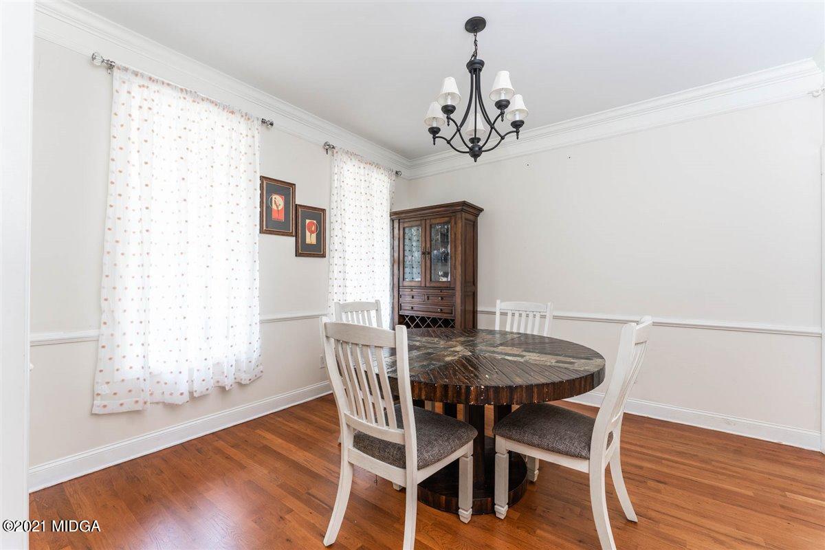 224 Carsons Walk Macon, GA 31206 - Photo 15 of 41 a view of a dining room with furniture window and wooden floor