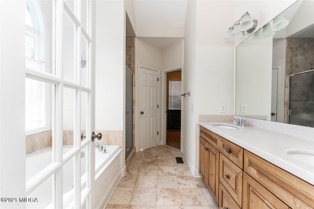 224 Carsons Walk Macon, GA 31206 - Photo 19 of 41 a spacious bathroom with a tub sink and mirror