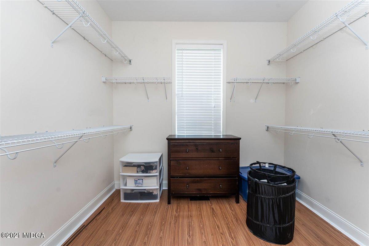 224 Carsons Walk Macon, GA 31206 - Photo 21 of 41 a view of walk in closet with empty racks