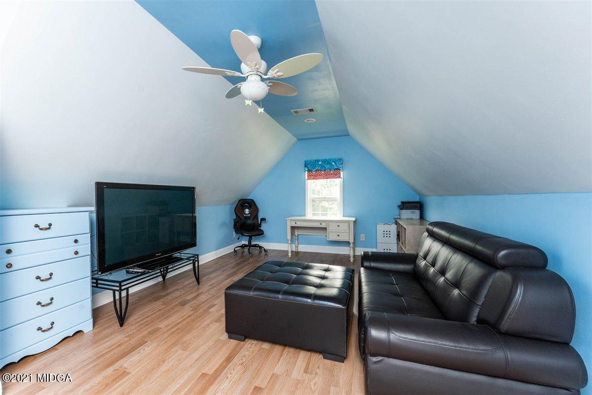224 Carsons Walk Macon, GA 31206 - Photo 25 of 41 a living room with furniture and a flat screen tv