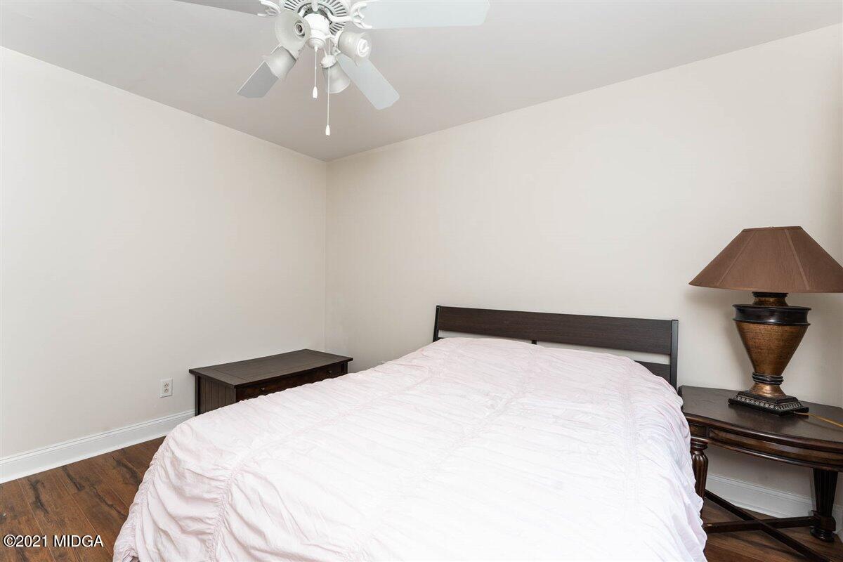 224 Carsons Walk Macon, GA 31206 - Photo 28 of 41 a bedroom with a bed and a chandelier