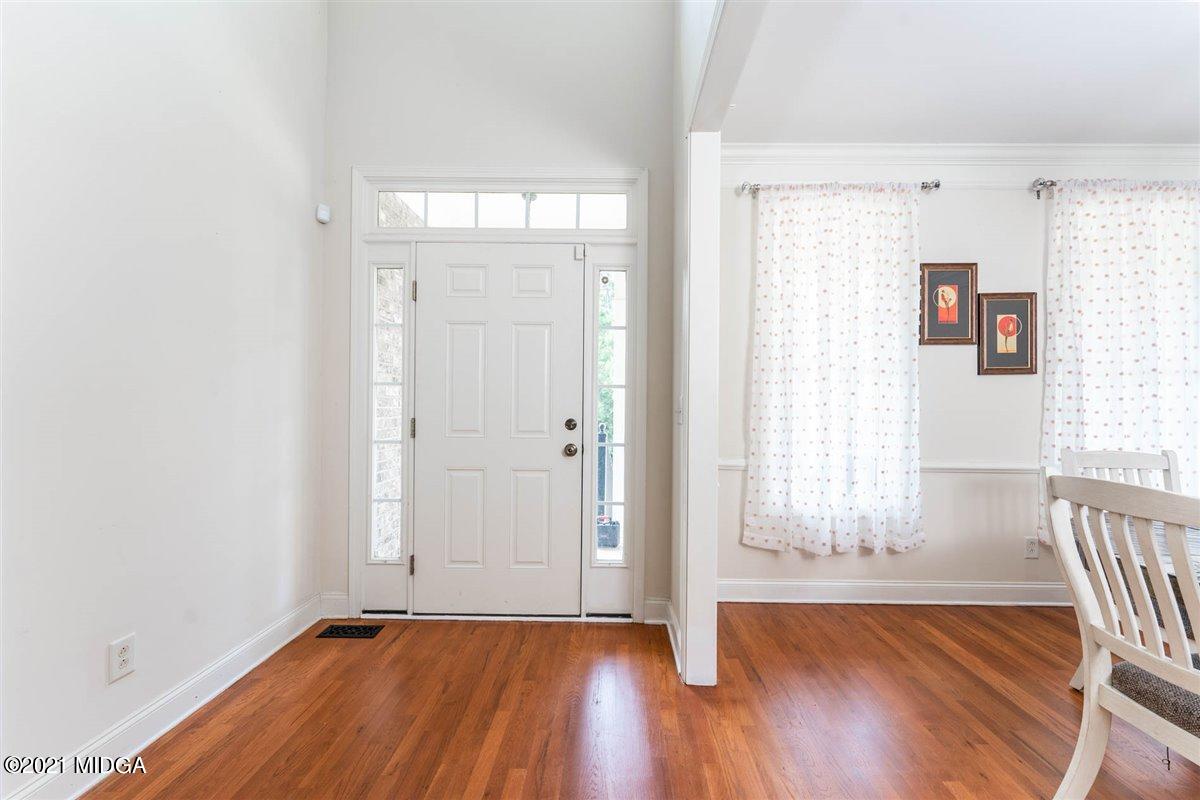 224 Carsons Walk Macon, GA 31206 - Photo 6 of 41 a view of an empty room with wooden floor and a window