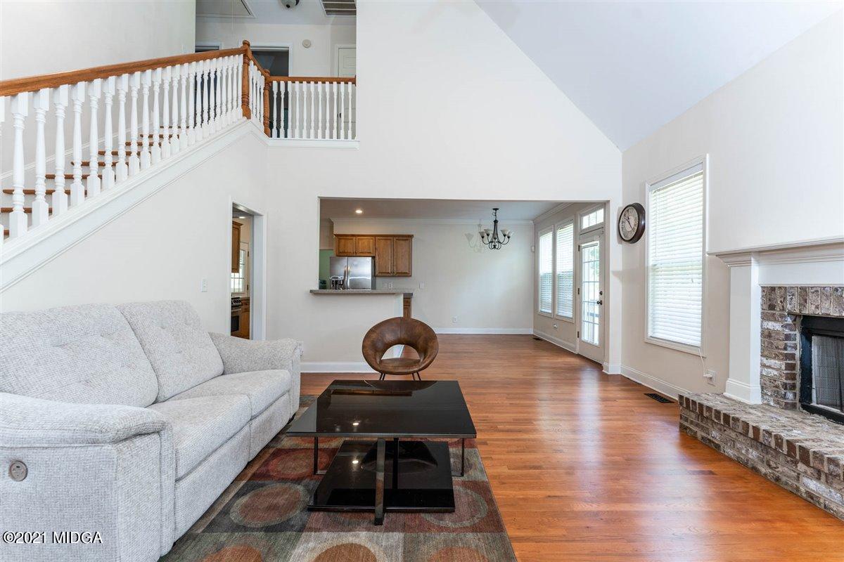 224 Carsons Walk Macon, GA 31206 - Photo 7 of 41 a living room with furniture and a wooden floor