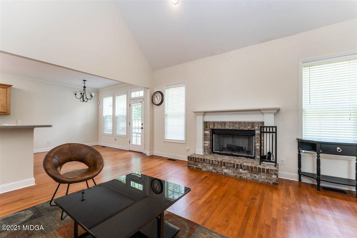 224 Carsons Walk Macon, GA 31206 - Photo 8 of 41 a living room with furniture and a fireplace