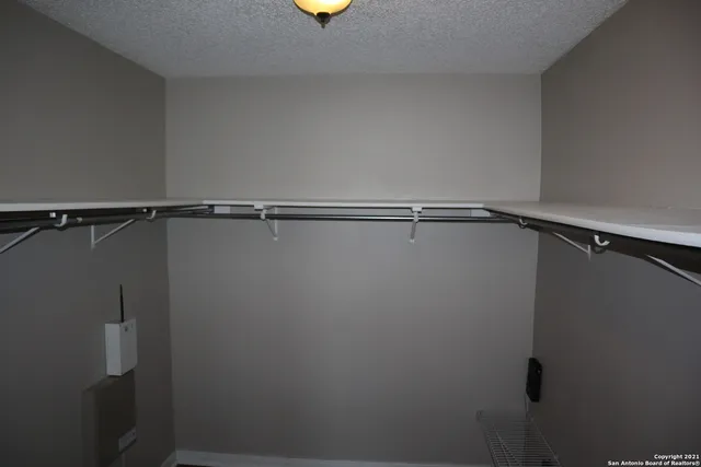 a view of an empty walk in closet