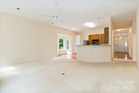 a view of a kitchen with a sink and a refrigerator