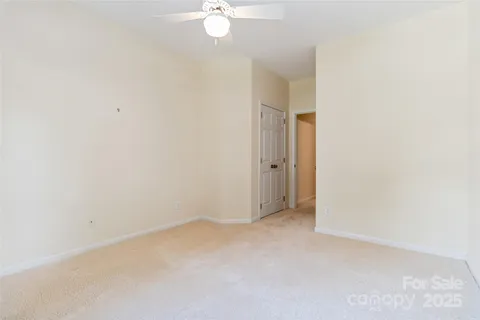 an empty room with a fan