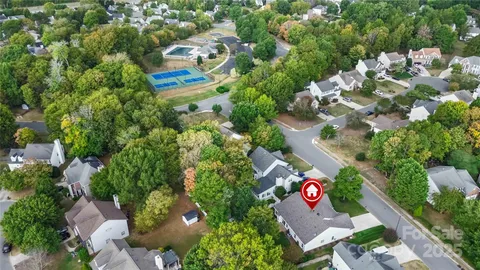 an aerial view of residential house with outdoor space and swimming pool