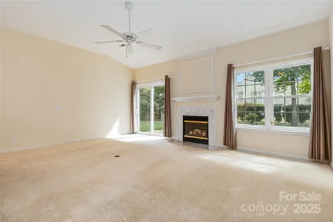 a view of an empty room with a fireplace