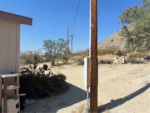 a view of a patio with table and chairs and potted plants