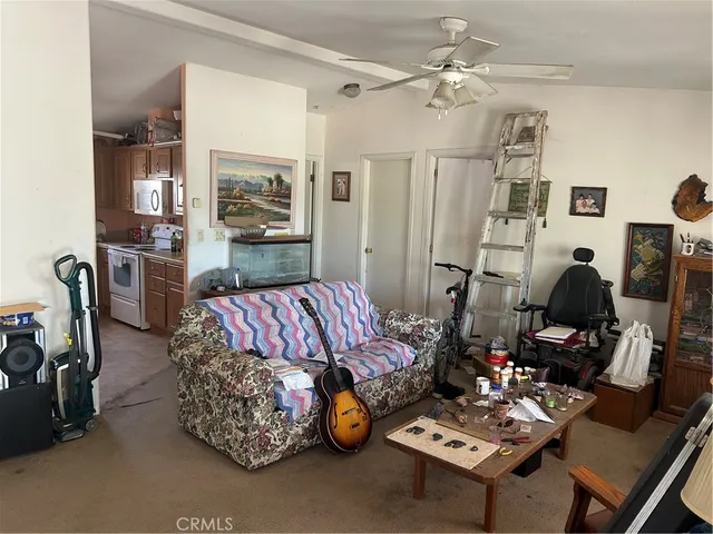 a kitchen with stainless steel appliances granite countertop a refrigerator and a stove