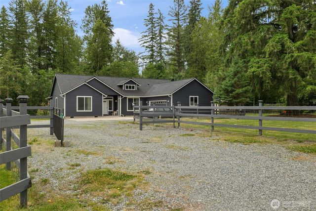 a house with trees in the background