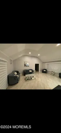 a view of kitchen island with stainless steel appliances