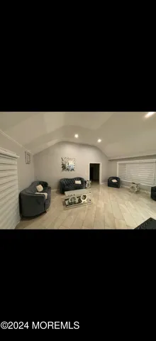a view of kitchen island with stainless steel appliances