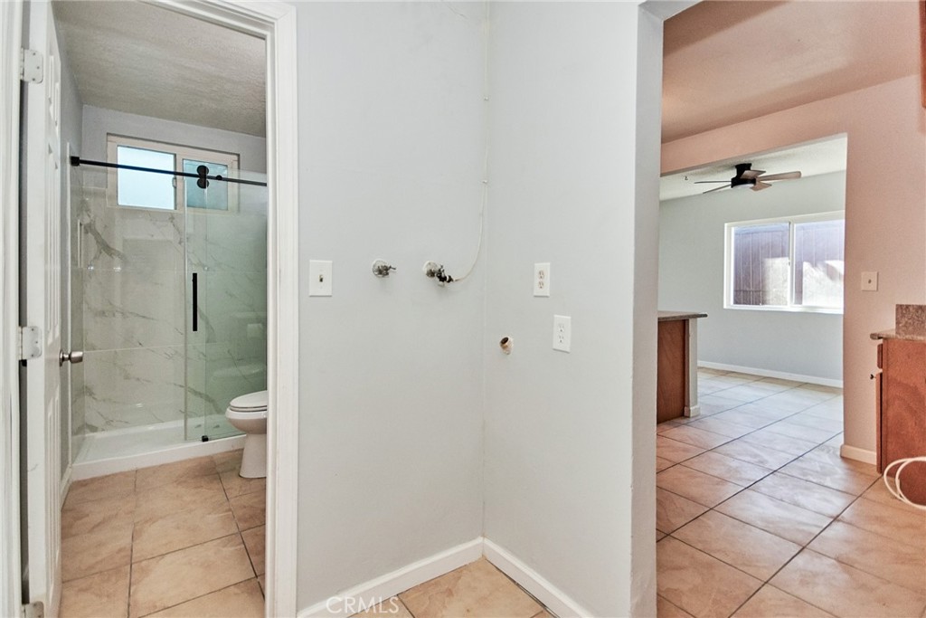 9510 1/2 Beverly Street Bellflower, CA 90706 - Photo 12 of 30 a bathroom with a shower and a toilet