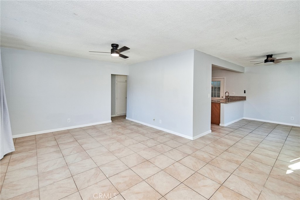 9510 1/2 Beverly Street Bellflower, CA 90706 - Photo 25 of 30 a view of a kitchen with a sink and a refrigerator