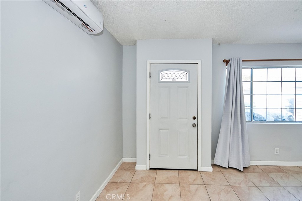 9510 1/2 Beverly Street Bellflower, CA 90706 - Photo 27 of 30 an empty room with windows