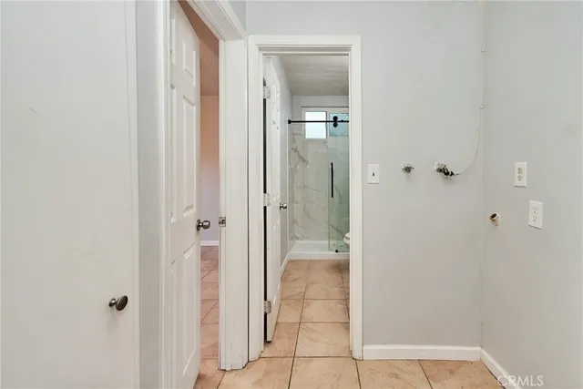 a view of a bathroom with a glass shower door