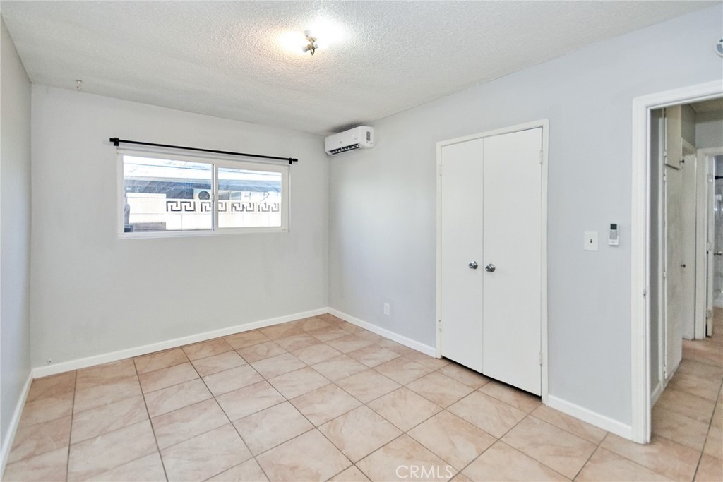 9510 1/2 Beverly Street Bellflower, CA 90706 - Photo 7 of 30 a view of an empty room and window