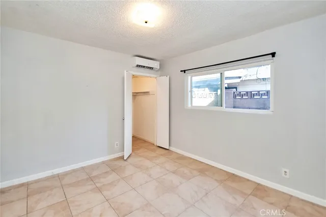 a view of an empty room with windows